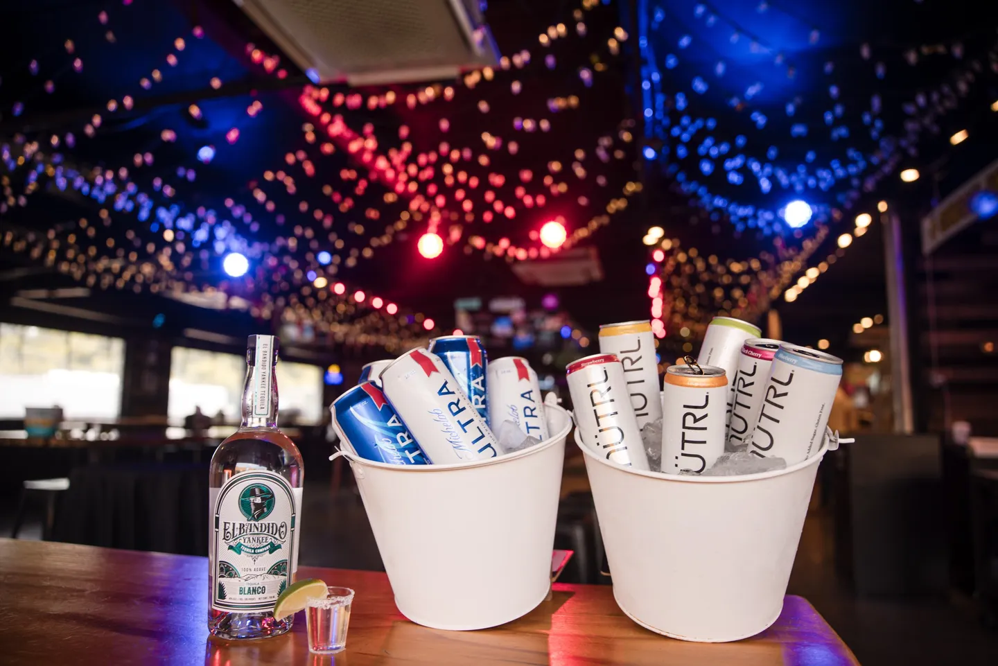 Beer and seltzer buckets with spirits at Honky Tonk Hideaway