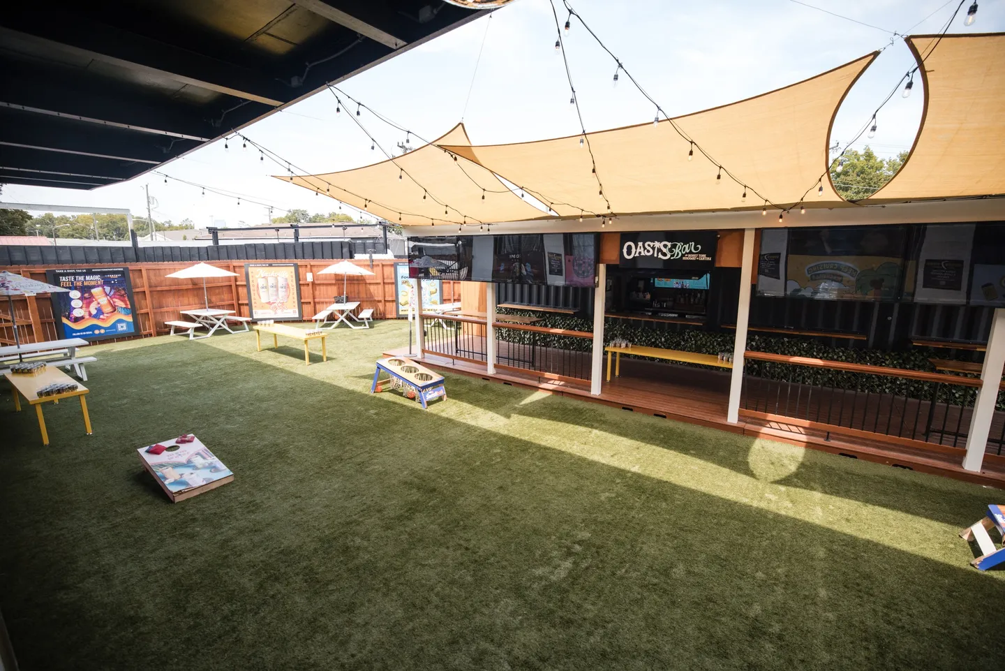 The Beer Garden at Honky Tonk Hideaway, with shade sails, seating and lawn games