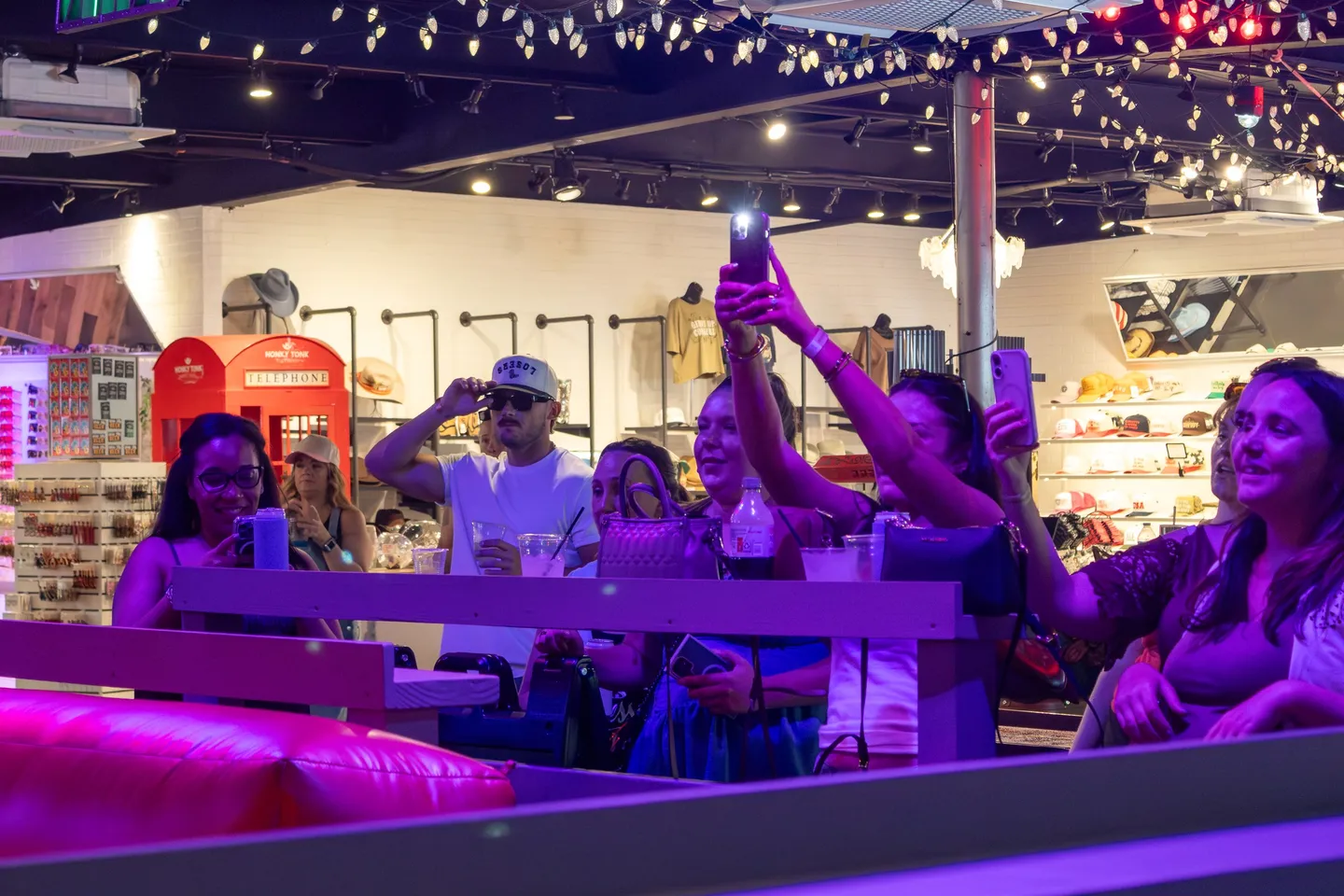 Guests enjoying the mechanical-bull area at Honky Tonk Hideaway