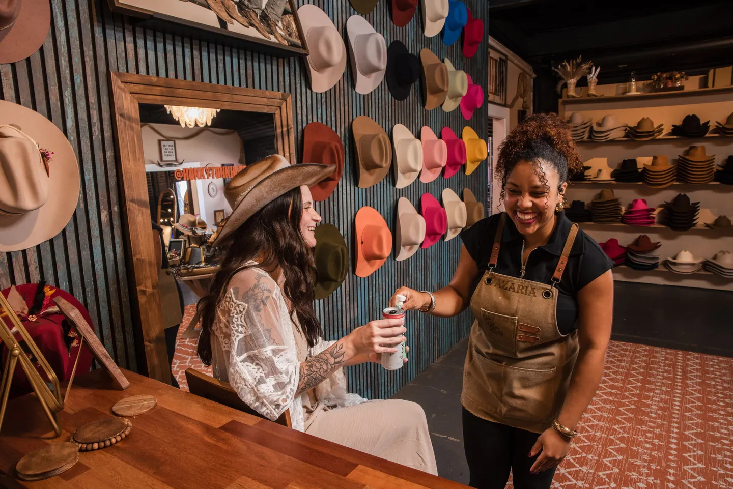 A guest wearing a cowboy hat during a session at Honky Tonk Hat Bar