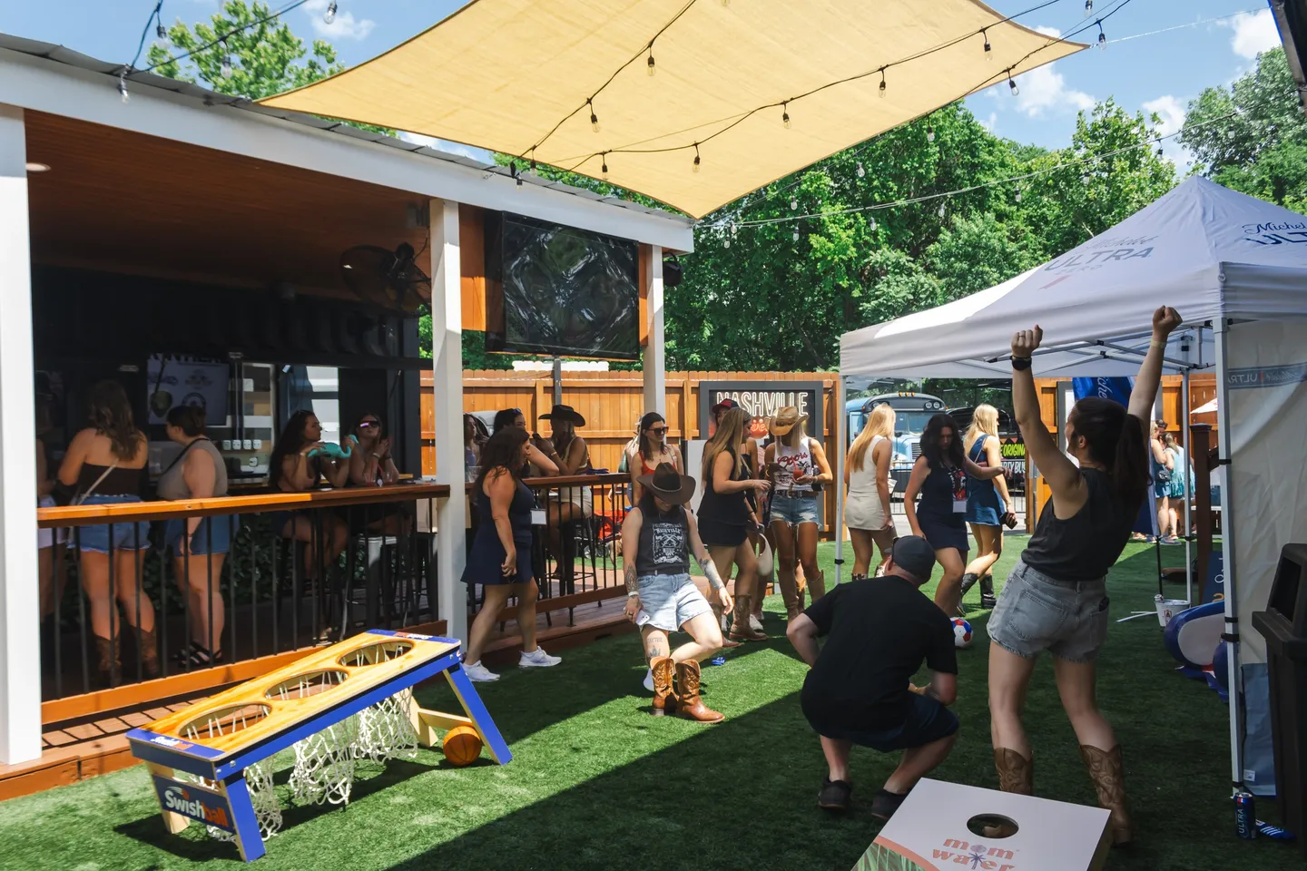 Guests gathering in the Honky Tonk Hideaway Beer Garden