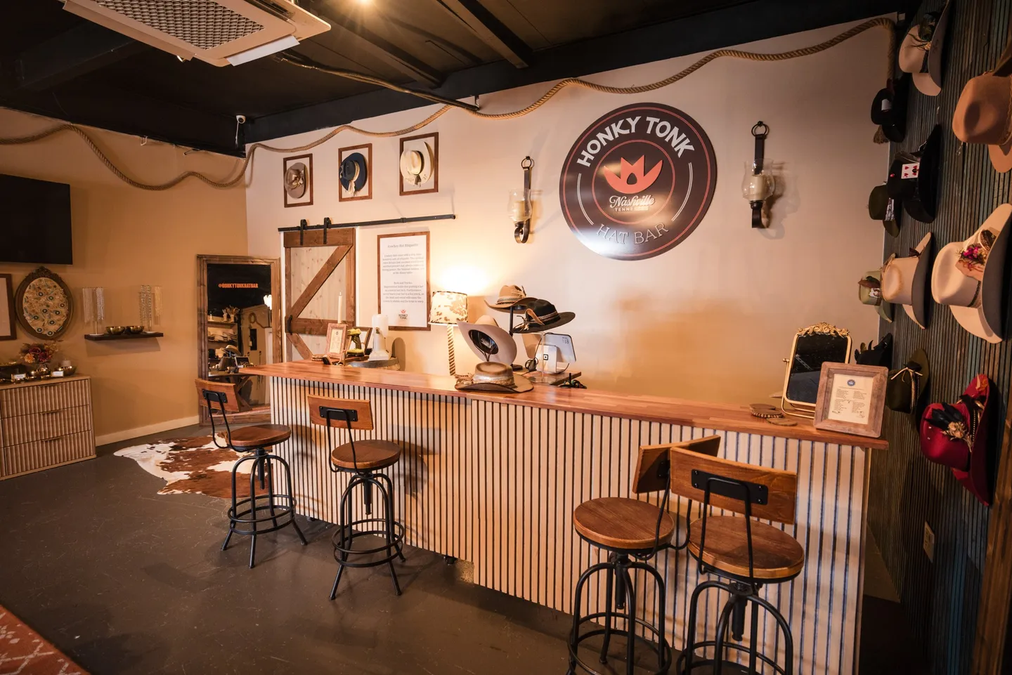 Seating and hat displays in the Honky Tonk Hat Bar at Honky Tonk Hideaway