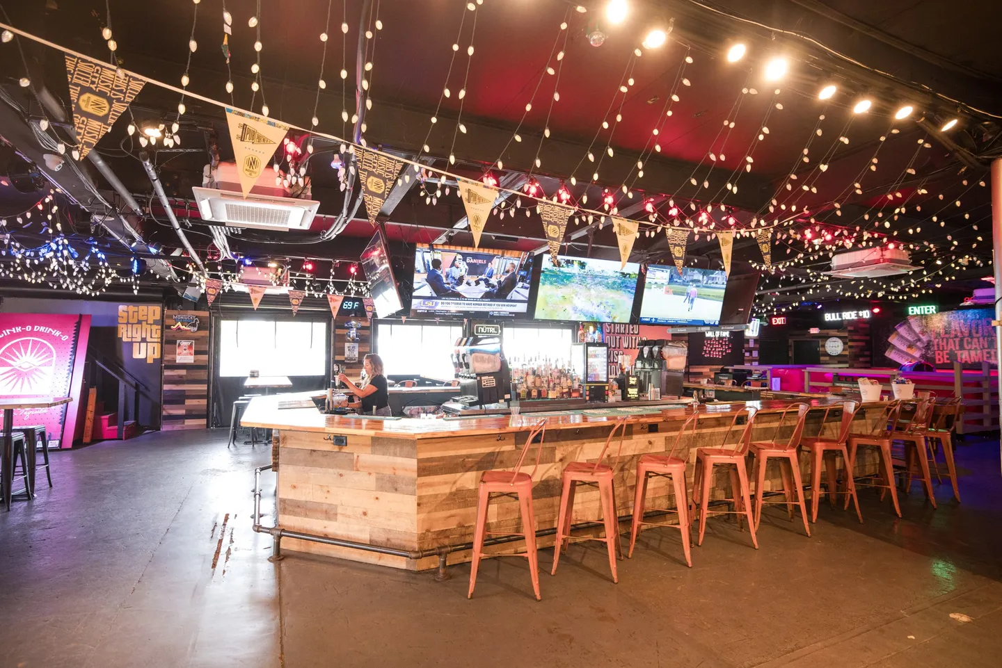 The Main Bar at Honky Tonk Hideaway beneath string lights