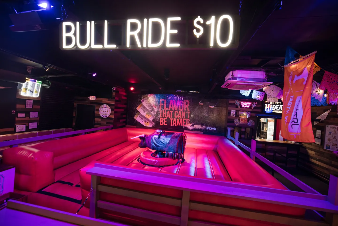 The indoor mechanical-bull station at Honky Tonk Hideaway