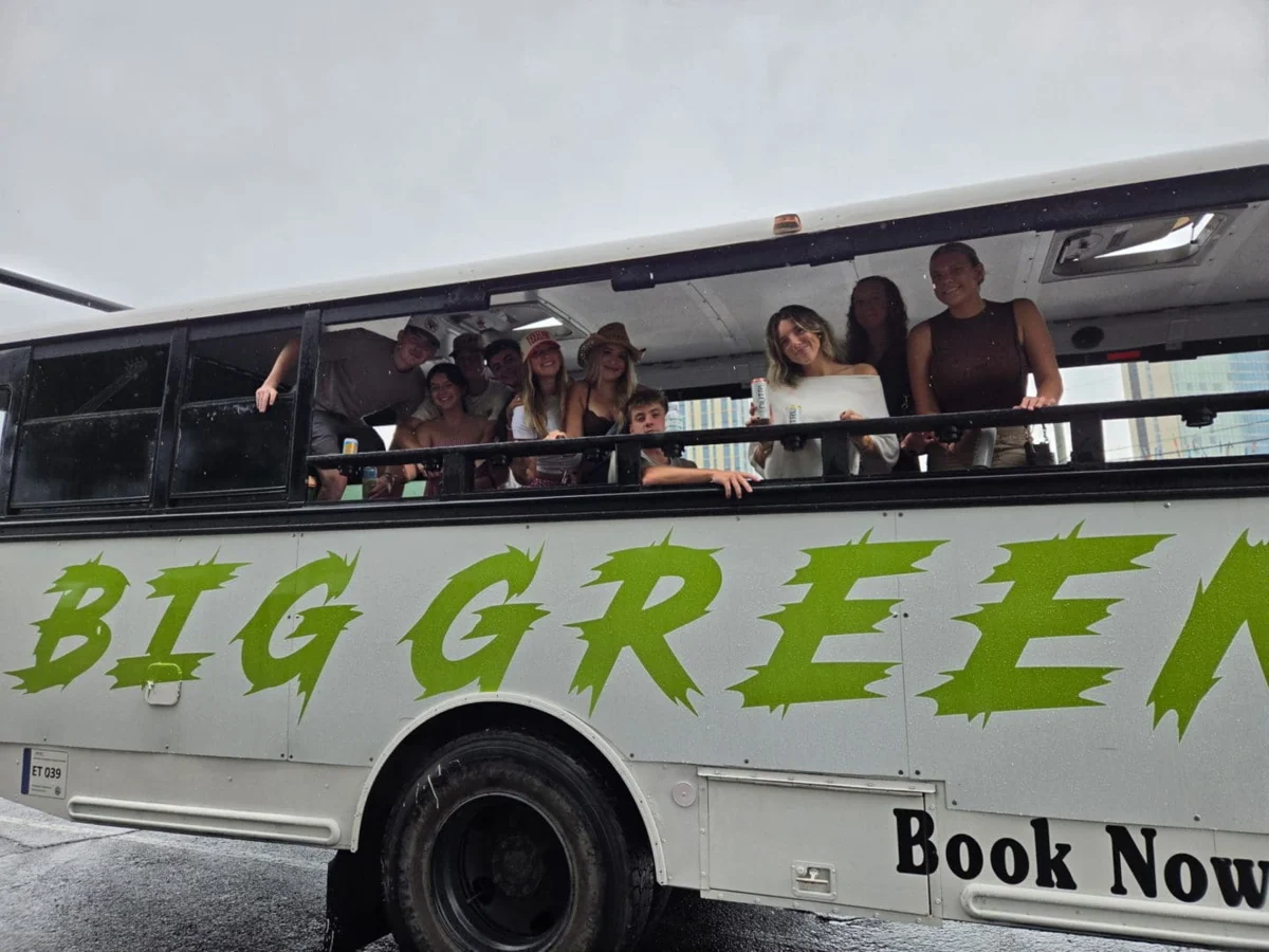 Guests aboard a Big Green tour bus