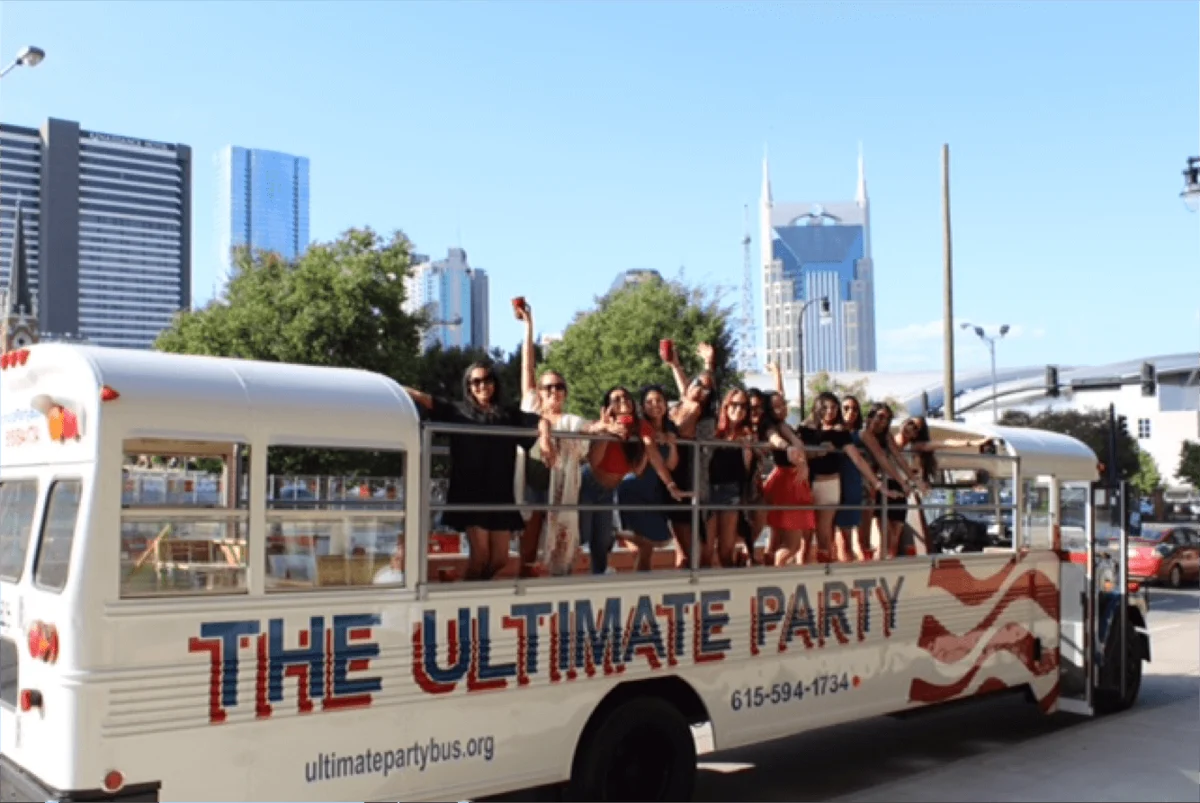 Guests on the open deck of The Ultimate Party Bus in Nashville